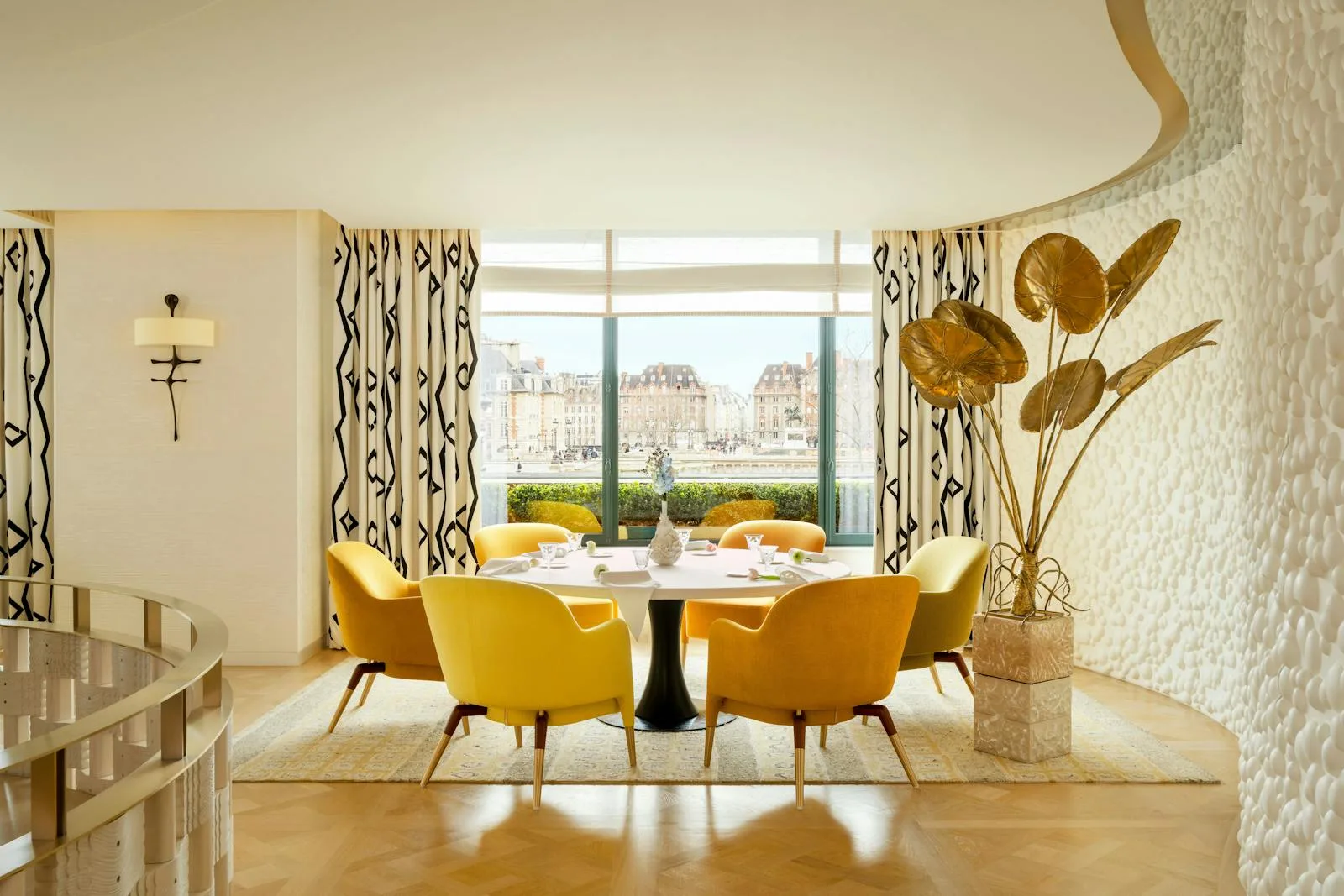 The dining room of Plénitude, the three-Michelin-starred restaurant at Cheval Blanc Paris, overlooking the Seine.