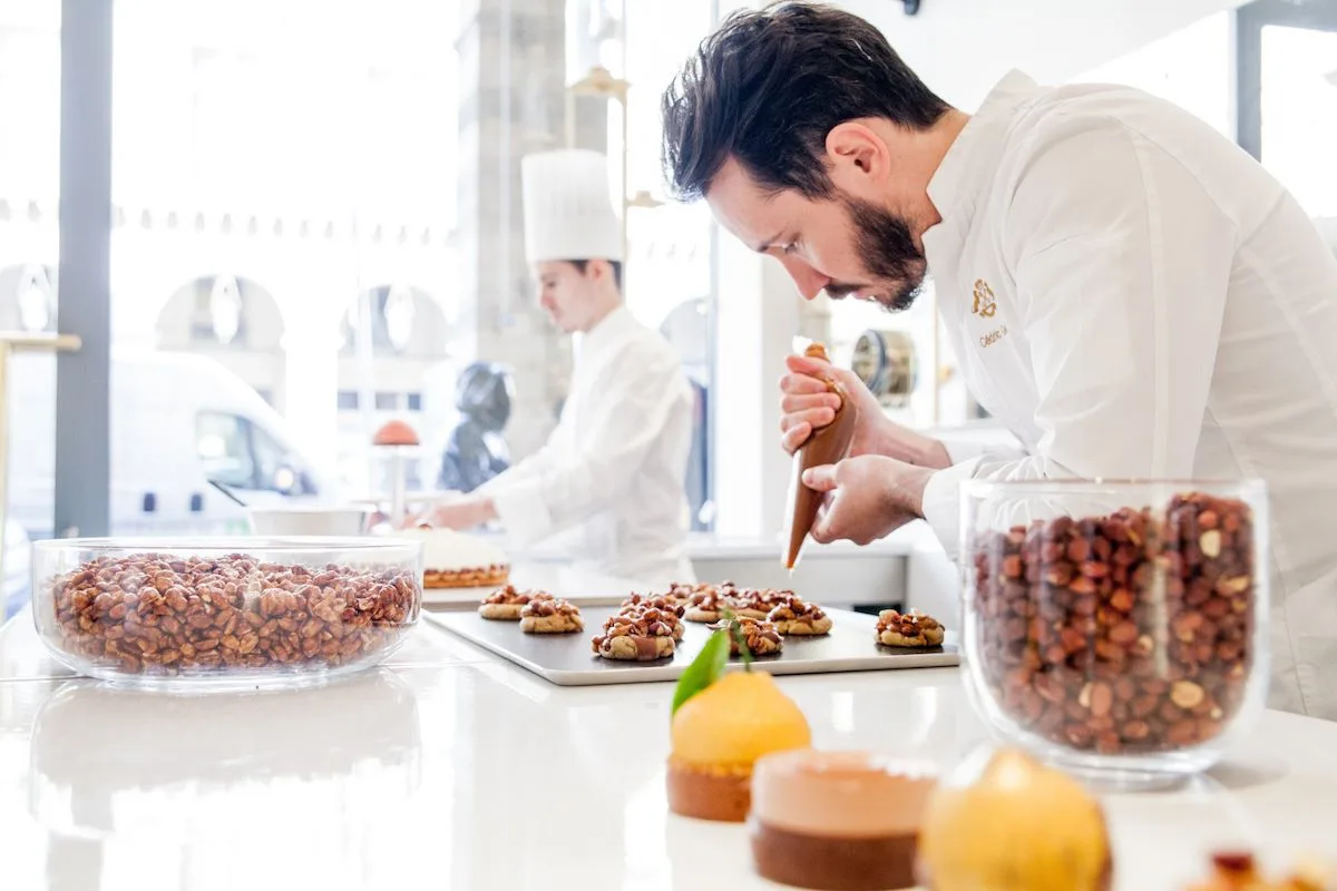 Pastry chef Cédric Grolet at work on his trompe-l'oeil fruit desserts at La Pâtisserie du Meurice.