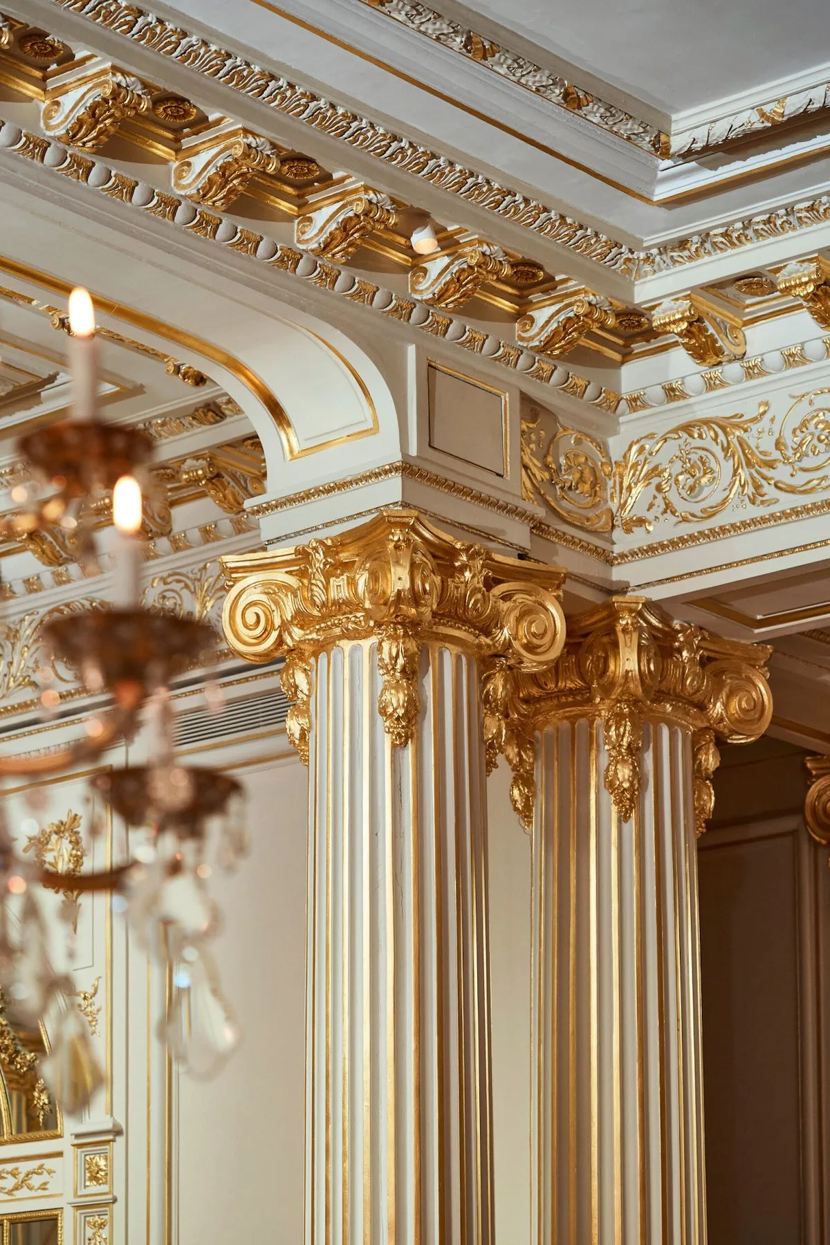 The gilded ceiling and columns of La Grande Table du Plaza Athénée, the hotel's Michelin-starred restaurant.