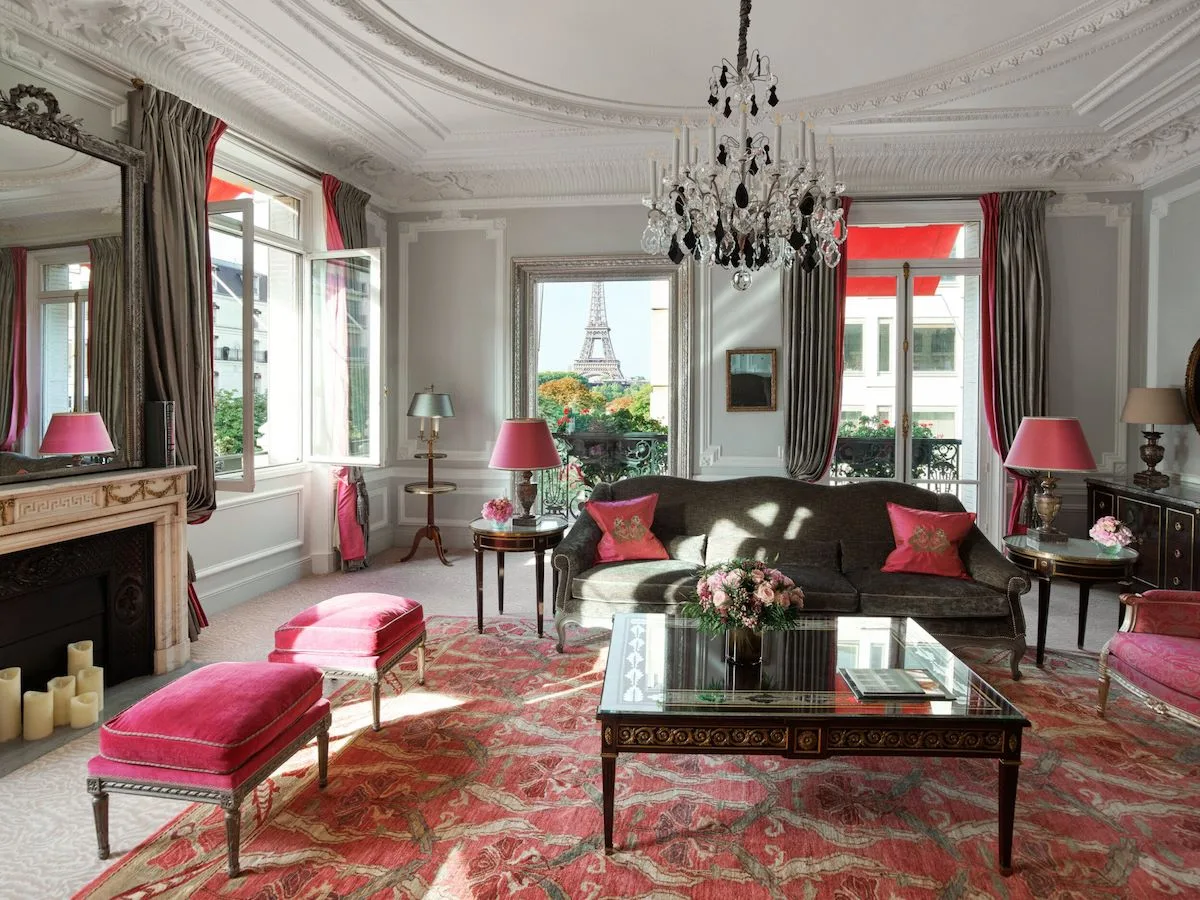 The Haute Couture Eiffel Suite at Hôtel Plaza Athénée, its window framing the Eiffel Tower.
