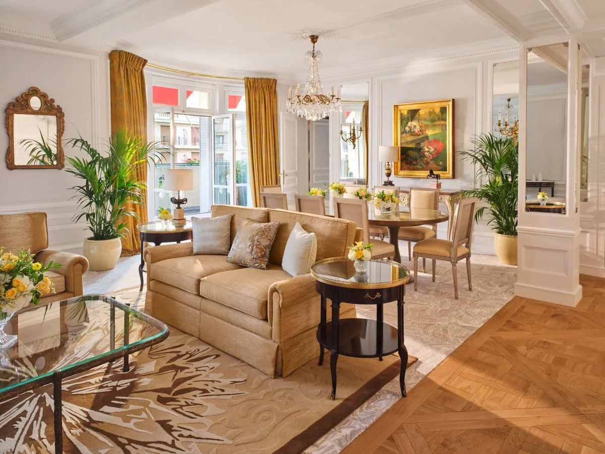 The living and dining room of the Royal Suite at Hôtel Plaza Athénée, Louis XVI-style furniture throughout.