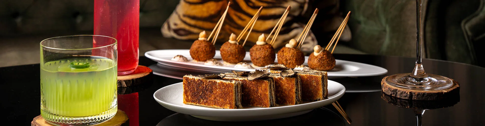 Cocktails and bar snacks at Le Bar Botaniste, designed by Pierre-Yves Rochon in tribute to Napoleonic-era tents.