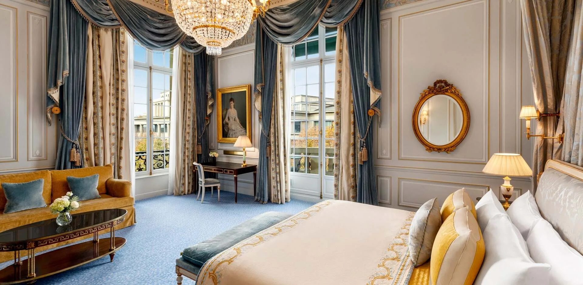 A guest room in the Prince Roland Bonaparte apartment, with a period portrait and Directoire-style furnishings.