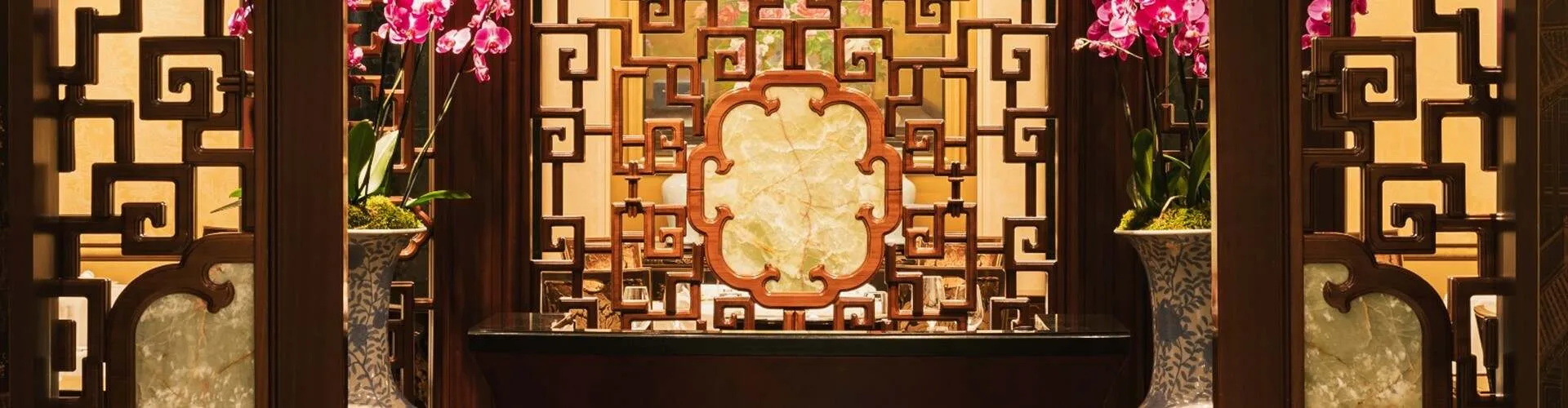 The dark-wood and jade-toned interior of Shang Palace, France’s only Michelin-starred Chinese restaurant.