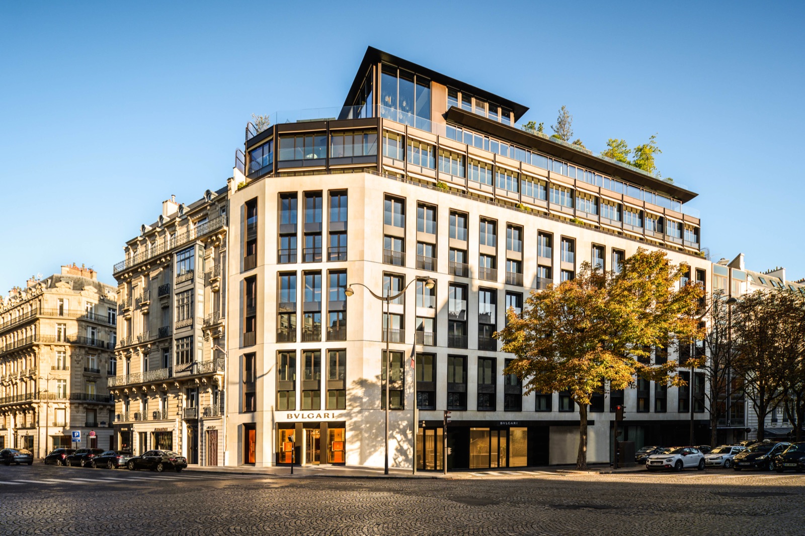 Bvlgari Hotel Paris's corner facade near the Champs-Élysées, at golden hour.