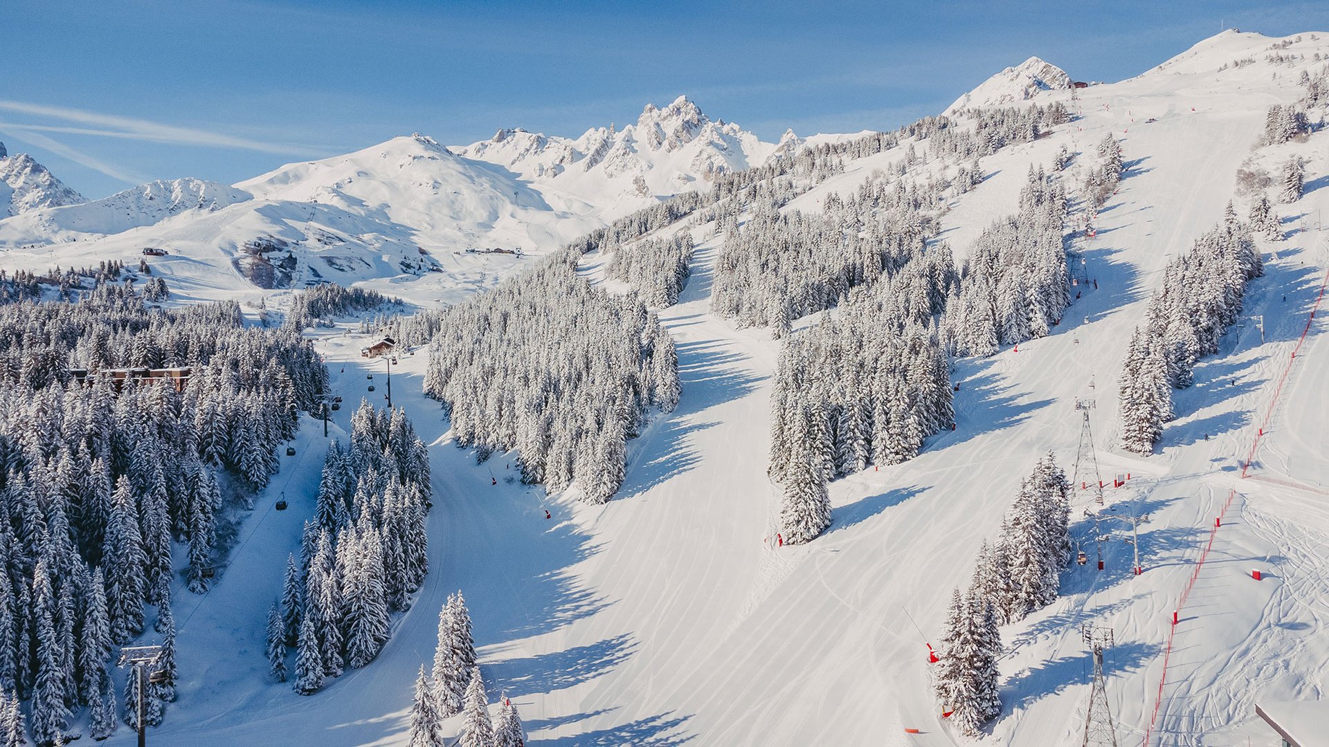 The Bellecôte ski run below the hotel, with the Three Valleys peaks beyond.