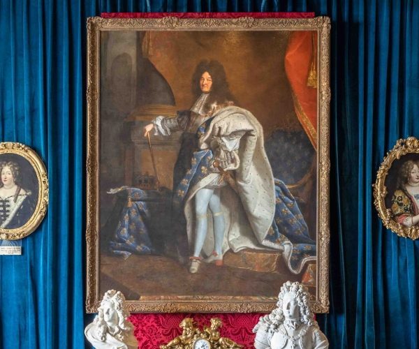 Hyacinthe Rigaud's official portrait of Louis XIV in coronation robes, one of only three in existence, on display in the bar Le Versailles.
