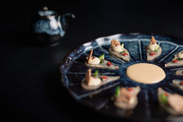 A ceviche-style seafood appetizer plated at L’Altiplano, Le K2 Palace’s two-Michelin-starred Peruvian restaurant.