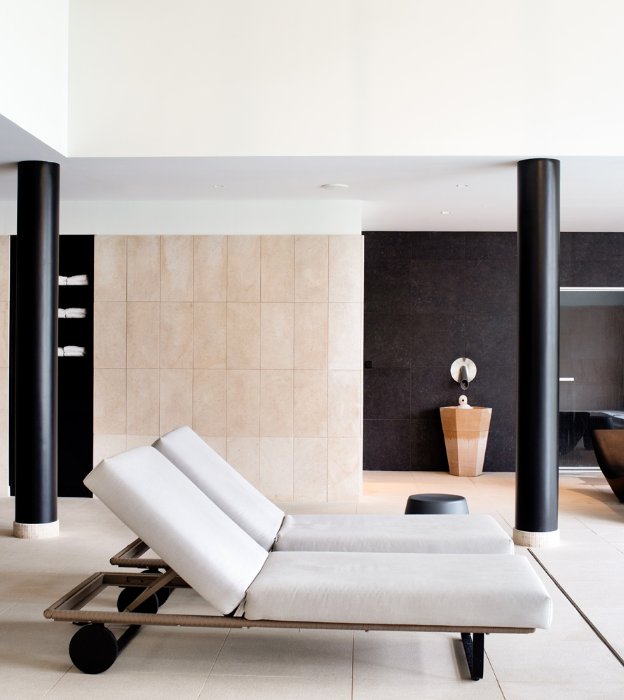 The vineaSpa's relaxation lounge, with loungers beside the indoor pool.