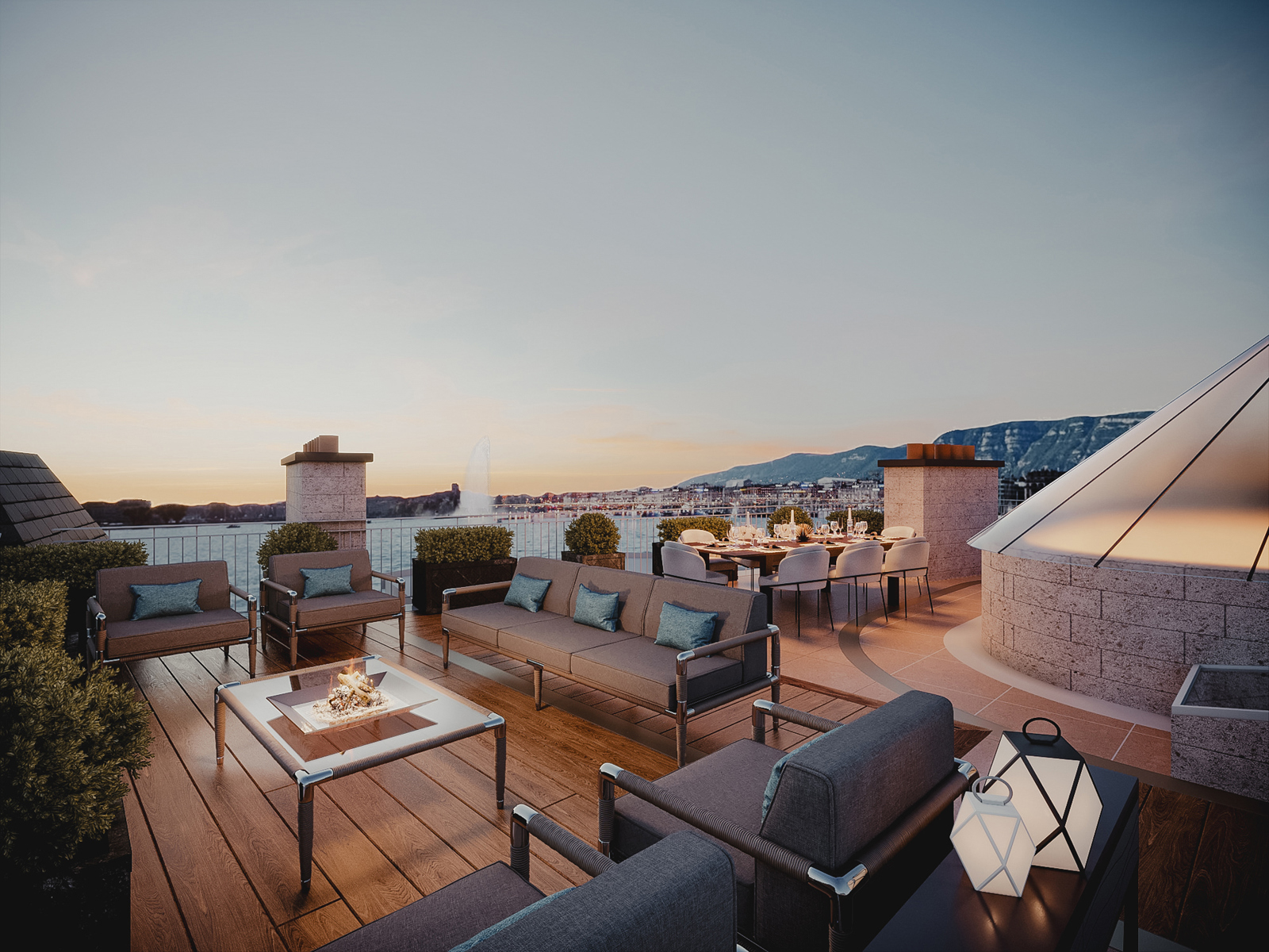 La terrasse privée sur le toit du duplex, avec vue sur le lac et le Jet d'Eau au crépuscule.