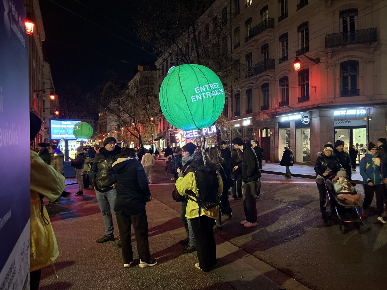 A night street during the Fête des Lumières in Lyon, 2025.