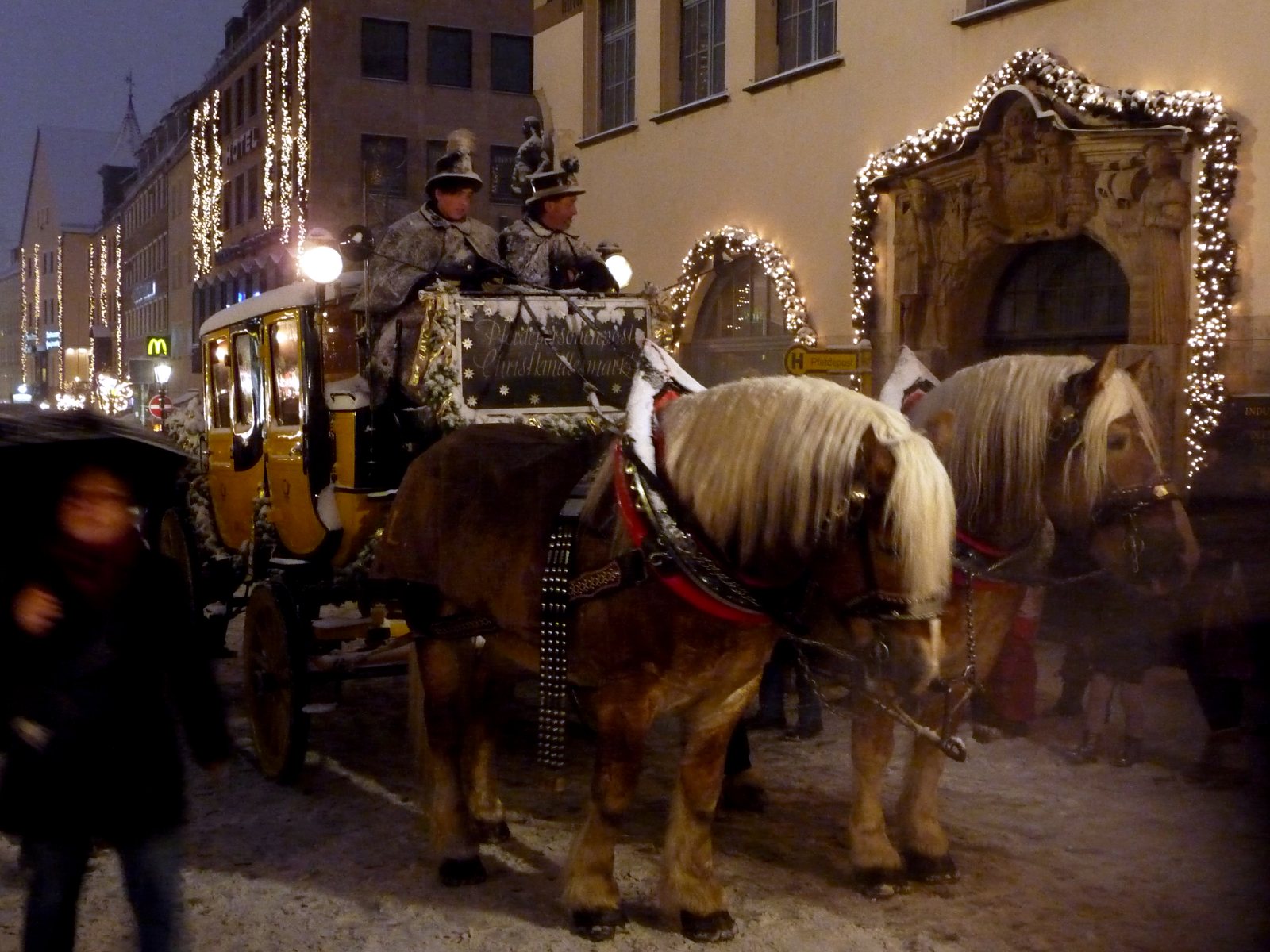 A horse-drawn carriage in Nuremberg at Christmas.