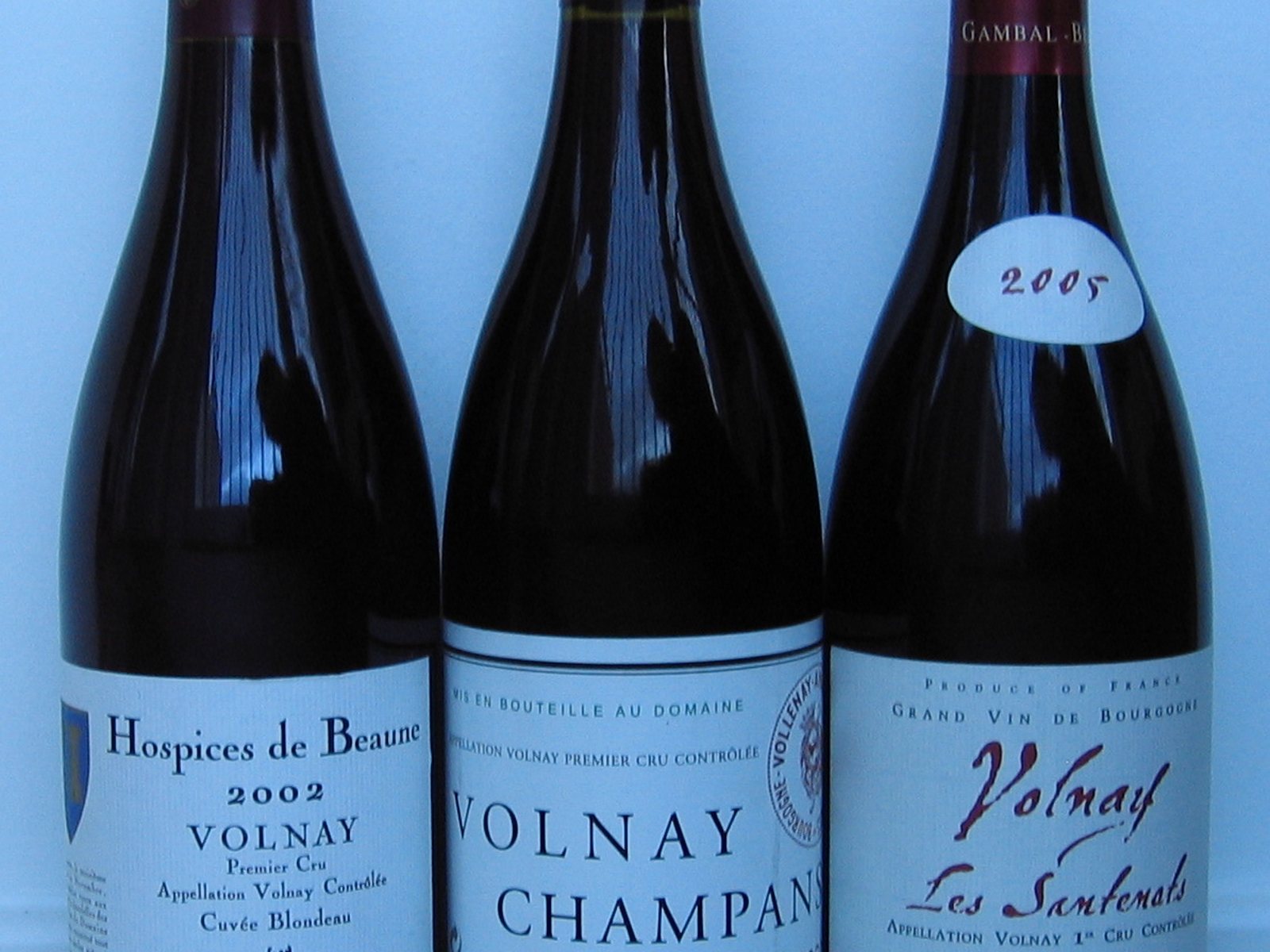 Bottles of Volnay, one labelled Hospices de Beaune.
