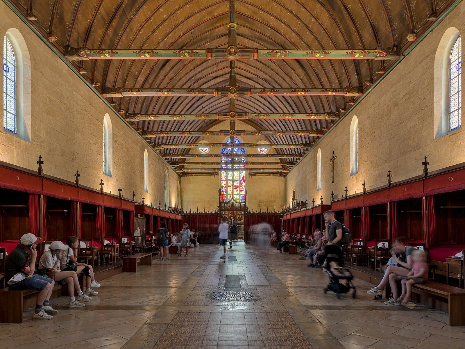 The great hall of the Hôtel-Dieu in Beaune with its painted timber roof.